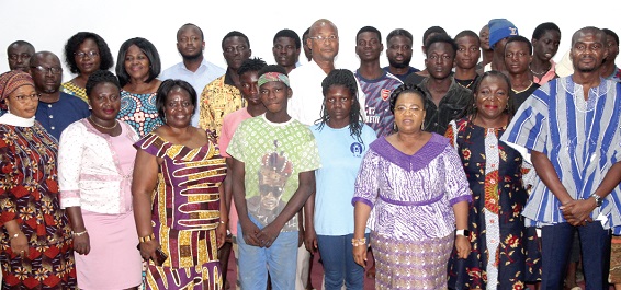  Daniel Mumuni (right), Catholic Relief Services; Dr Ernestina Tetteh (2nd from right), Convener of NPOs Working with Street Children; Rev. Dr Comfort Asare (3rd from right), Director, Department of Social Welfare, and Georgina Mensah (3rd from left), Deputy Director, Department of Social Welfare, with some of the street children. Picture: ESTHER ADJORKOR ADJEI